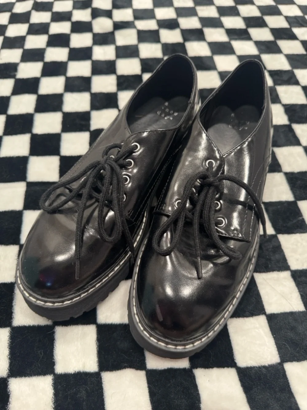 a new day glossy black